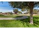 Curved pathway winding through grassy park at 1358 E Jardin Dr, Casa Grande, AZ 85122