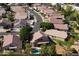 Aerial view of a residential neighborhood, highlighting a house and pool at 1503 N Quail Ln, Gilbert, AZ 85233