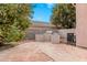 Brick paved backyard with a built-in grill and lemon tree at 1503 N Quail Ln, Gilbert, AZ 85233