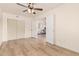 Bright bedroom with light wood floors and access to other rooms at 1503 N Quail Ln, Gilbert, AZ 85233