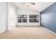 Spacious bedroom with carpet flooring and an ensuite bathroom at 1503 N Quail Ln, Gilbert, AZ 85233