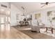 Bright dining room with hardwood floors and stylish light fixture at 1503 N Quail Ln, Gilbert, AZ 85233