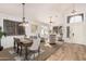 Open concept dining area with hardwood floors at 1503 N Quail Ln, Gilbert, AZ 85233