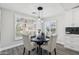 Kitchen breakfast nook with round table and white chairs at 15045 W Mulberry Dr, Goodyear, AZ 85395