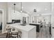 Modern kitchen with white cabinets and a large island at 15045 W Mulberry Dr, Goodyear, AZ 85395