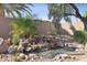 Lovely backyard water feature with waterfall and pond at 15045 W Mulberry Dr, Goodyear, AZ 85395