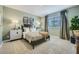 Cozy bedroom with a dark wood bed frame, muted color palette, and calming atmosphere at 1505 W J Waltz Way, Apache Junction, AZ 85120