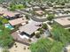 Aerial view of a house with pool and landscaped backyard in a residential neighborhood at 15338 W Montecito Ave, Goodyear, AZ 85395