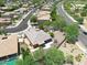 Aerial view showing a single-Gathering home's exterior, landscaping, and neighborhood context at 15338 W Montecito Ave, Goodyear, AZ 85395