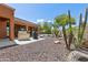 Backyard patio with grill, gravel landscaping, and desert plants at 15338 W Montecito Ave, Goodyear, AZ 85395