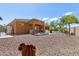 Large backyard with gravel, desert landscaping, and a covered patio at 15338 W Montecito Ave, Goodyear, AZ 85395