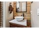 Bathroom with a modern vessel sink and wood vanity at 15338 W Montecito Ave, Goodyear, AZ 85395