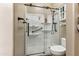 Updated bathroom with walk-in shower and built-in shelving at 15338 W Montecito Ave, Goodyear, AZ 85395