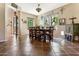 Rustic dining room with wood table and chairs, decorative accents and tile floors at 15338 W Montecito Ave, Goodyear, AZ 85395