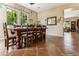 Rustic wooden dining table with six chairs in a spacious dining room at 15338 W Montecito Ave, Goodyear, AZ 85395