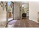 Inviting entryway with tile floors and view into dining area at 15338 W Montecito Ave, Goodyear, AZ 85395