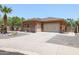 House exterior showcasing a two-car garage and desert landscaping at 15338 W Montecito Ave, Goodyear, AZ 85395