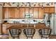 Bright kitchen boasts an island with wooden countertop at 15338 W Montecito Ave, Goodyear, AZ 85395