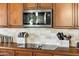 Modern kitchen features a microwave above a cooktop at 15338 W Montecito Ave, Goodyear, AZ 85395