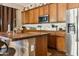 Kitchen island with wood countertop and butcher block at 15338 W Montecito Ave, Goodyear, AZ 85395