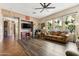 Living room with fireplace, wood-look floors, and comfortable seating at 15338 W Montecito Ave, Goodyear, AZ 85395