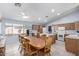 Kitchen features an island, ample cabinetry, and tile flooring at 15548 N 156Th Ln, Surprise, AZ 85374