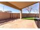 Spacious covered patio overlooking backyard pool at 15548 N 156Th Ln, Surprise, AZ 85374