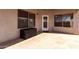 Covered patio with stone flooring and exterior access at 15548 N 156Th Ln, Surprise, AZ 85374