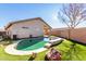 Inviting kidney-shaped pool with a spacious grassy backyard at 15548 N 156Th Ln, Surprise, AZ 85374