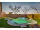 Inviting kidney-shaped pool with a tanning shelf at 15548 N 156Th Ln, Surprise, AZ 85374