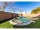 Stunning kidney-shaped pool and grassy backyard at 15548 N 156Th Ln, Surprise, AZ 85374