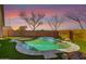 Well-maintained kidney shaped pool with a stone coping at 15548 N 156Th Ln, Surprise, AZ 85374