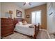 Charming bedroom with a double bed and wood furniture at 16005 S 10Th Pl, Phoenix, AZ 85048