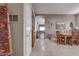 View of dining area with wooden table and access to the living room at 16005 S 10Th Pl, Phoenix, AZ 85048