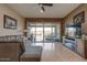 Gathering room with sliding doors that showcase a view of the pool at 16005 S 10Th Pl, Phoenix, AZ 85048