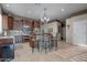 Kitchen with island, stainless steel appliances, and dark wood cabinetry at 16005 S 10Th Pl, Phoenix, AZ 85048