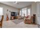 Living room with tiled floors, comfortable seating, and a dining area at 16005 S 10Th Pl, Phoenix, AZ 85048