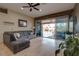 Living room features a large sectional sofa and sliding doors to the pool at 16005 S 10Th Pl, Phoenix, AZ 85048