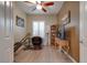 Home office features built-in shelving and hardwood floors at 16005 S 10Th Pl, Phoenix, AZ 85048