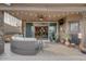 Covered patio with seating area and view into the home's interior at 16005 S 10Th Pl, Phoenix, AZ 85048