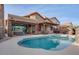 Inviting backyard with a large pool and patio at 16005 S 10Th Pl, Phoenix, AZ 85048