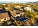 Aerial shot of a single-Gathering home with a private pool, lush landscaping, and a patio for outdoor relaxation at 17833 W Verdin Rd, Goodyear, AZ 85338