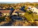 Aerial shot of a single-Gathering home with a private pool, lush landscaping, and a patio for outdoor relaxation at 17833 W Verdin Rd, Goodyear, AZ 85338