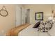 Well-lit bedroom with closet; features decorative wall art and a comforting, inviting bed at 17833 W Verdin Rd, Goodyear, AZ 85338