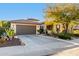 Beautiful home featuring a desert landscape, a two car garage, and a tiled roof at 17833 W Verdin Rd, Goodyear, AZ 85338