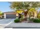 Beautiful home featuring a desert landscape, a two car garage, and a tiled roof at 17833 W Verdin Rd, Goodyear, AZ 85338