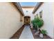 Inviting front entrance featuring desert landscaping and a charming front door with a decorative wreath at 17833 W Verdin Rd, Goodyear, AZ 85338