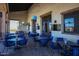 Charming outdoor patio with elegant seating arrangements creating an inviting space for dining and socializing at 17833 W Verdin Rd, Goodyear, AZ 85338