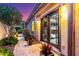 Serene outdoor patio features double doors leading to a landscaped yard with stone pathway and desert foliage at 17833 W Verdin Rd, Goodyear, AZ 85338