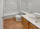 Clean bathroom with a shower/tub combo, toilet, and vanity at 18206 N 86Th Ln, Peoria, AZ 85382